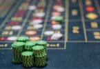 Stacks of green colored gambling chips