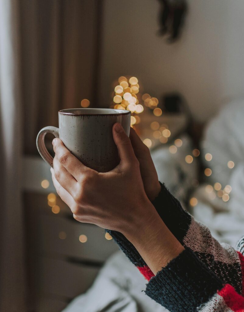 Person holding gray mug